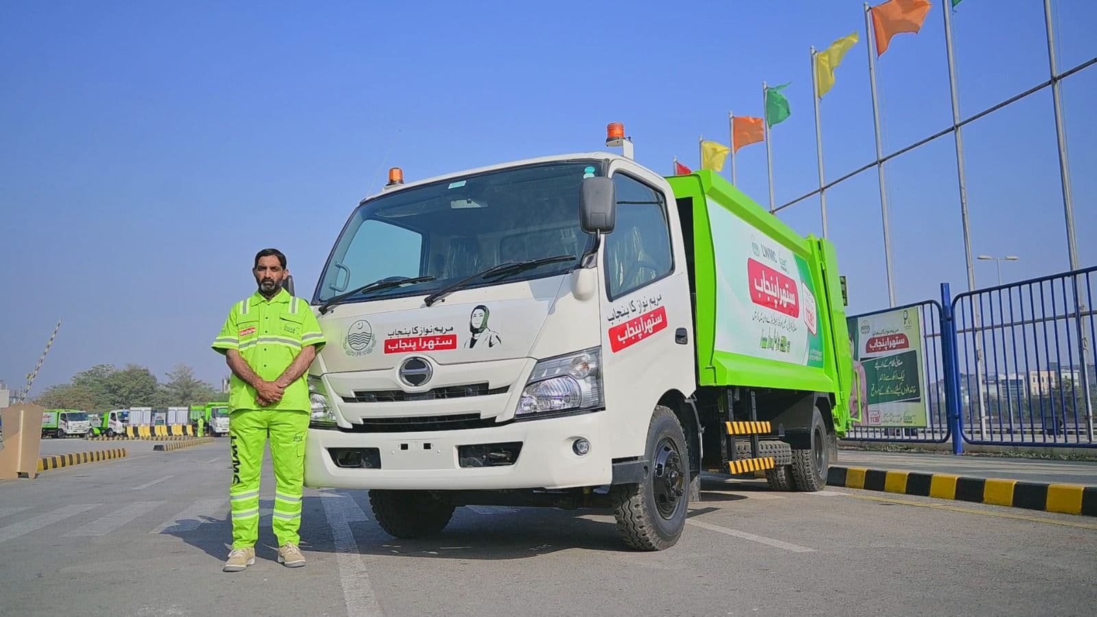 worker standing next to truck